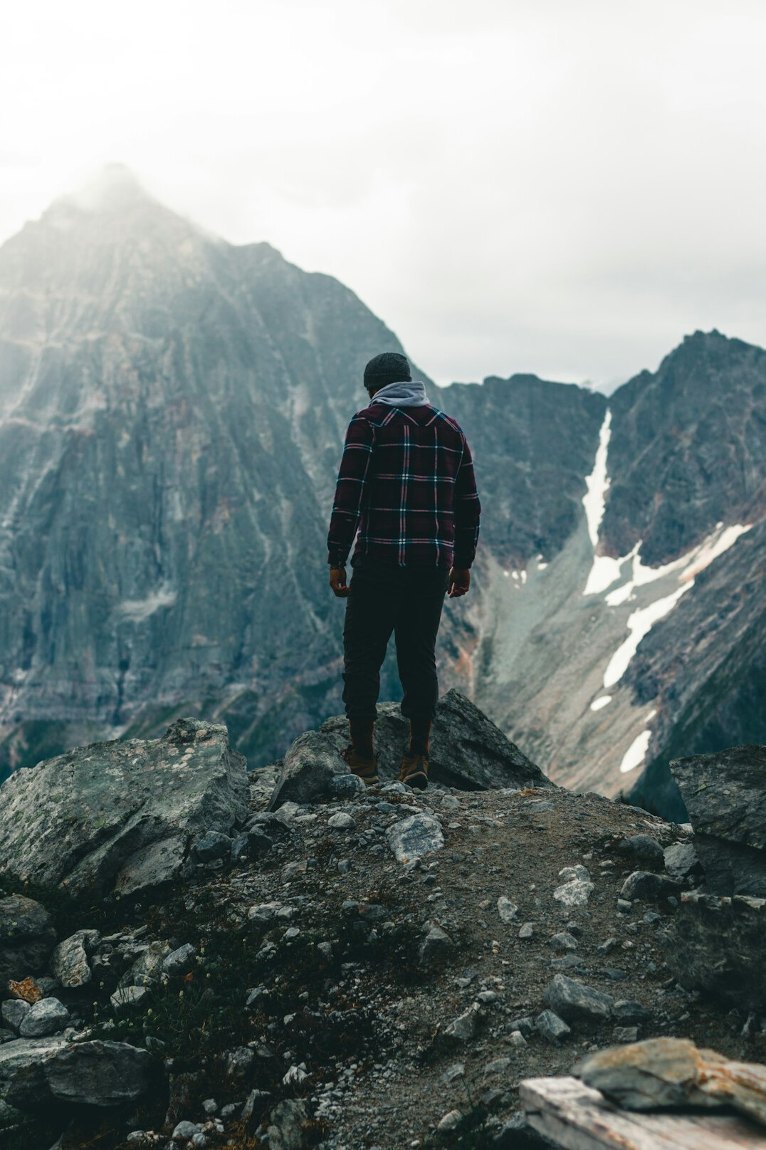 person standing on mountain peak